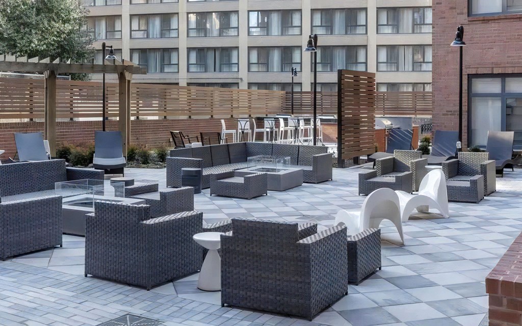 Patio Lounge Featuring Sectional Furniture and Fire Tables