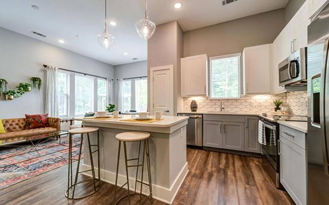 a kitchen with a center island and a counter top