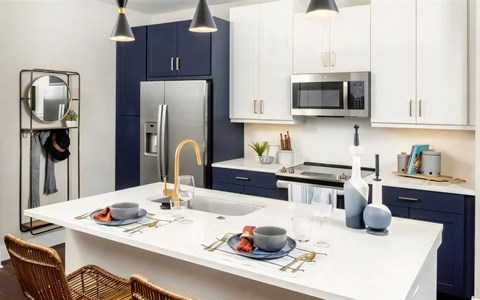 Broadstone Upper Westside Apartments Kitchen Island Kitchen with Breakfast Bar Ample Cabinet Space and Self Closing Drawers Broadstone Upper Westside Apartments Kitchen Island Kitchen with Breakfast Bar Ample Cabinet Space and Self Closing Drawers