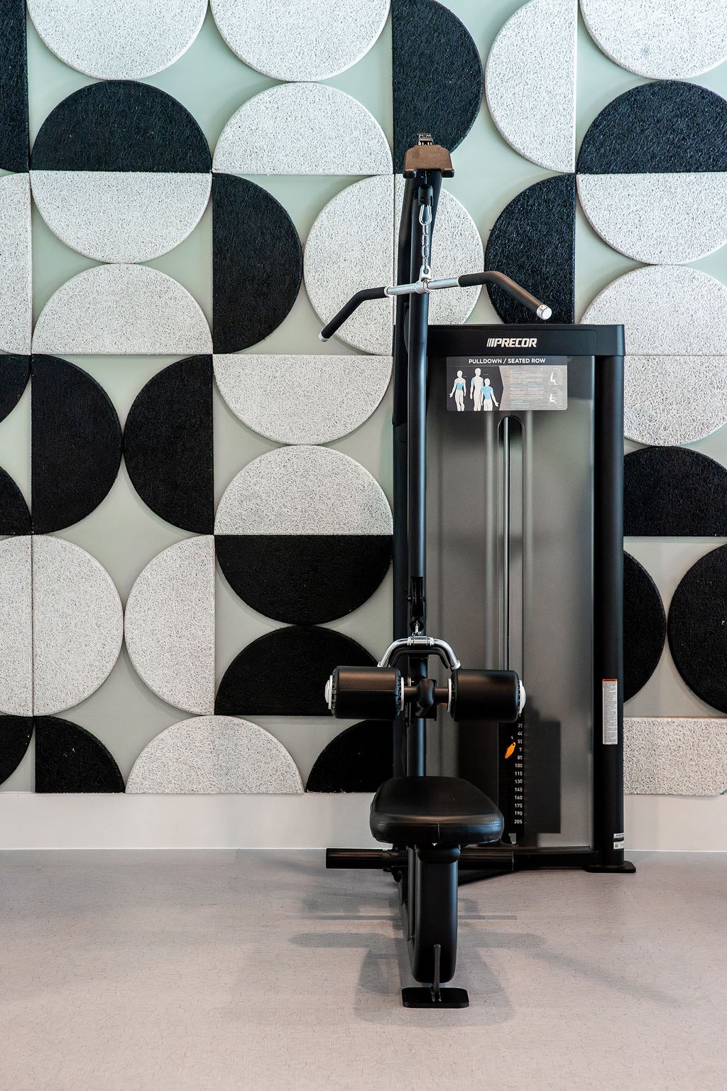 a black dyson machine in a room with a black chair