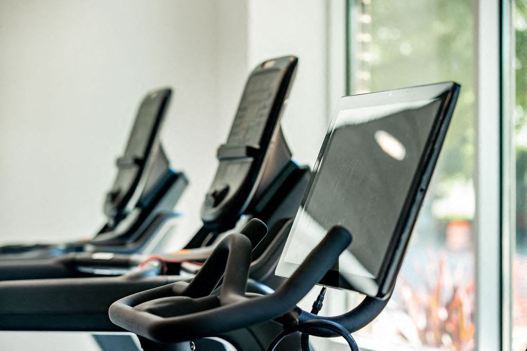 a row of laptop computers sitting in a room