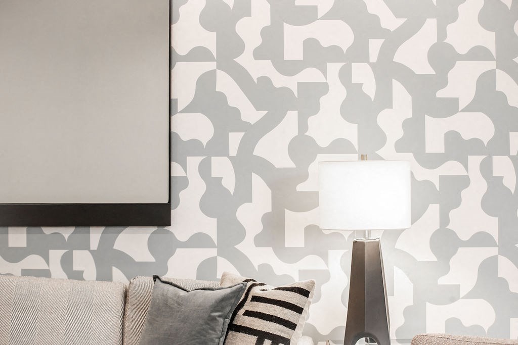 a living room with a couch and a lamp