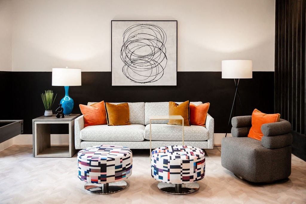 a living room with a couch and tables