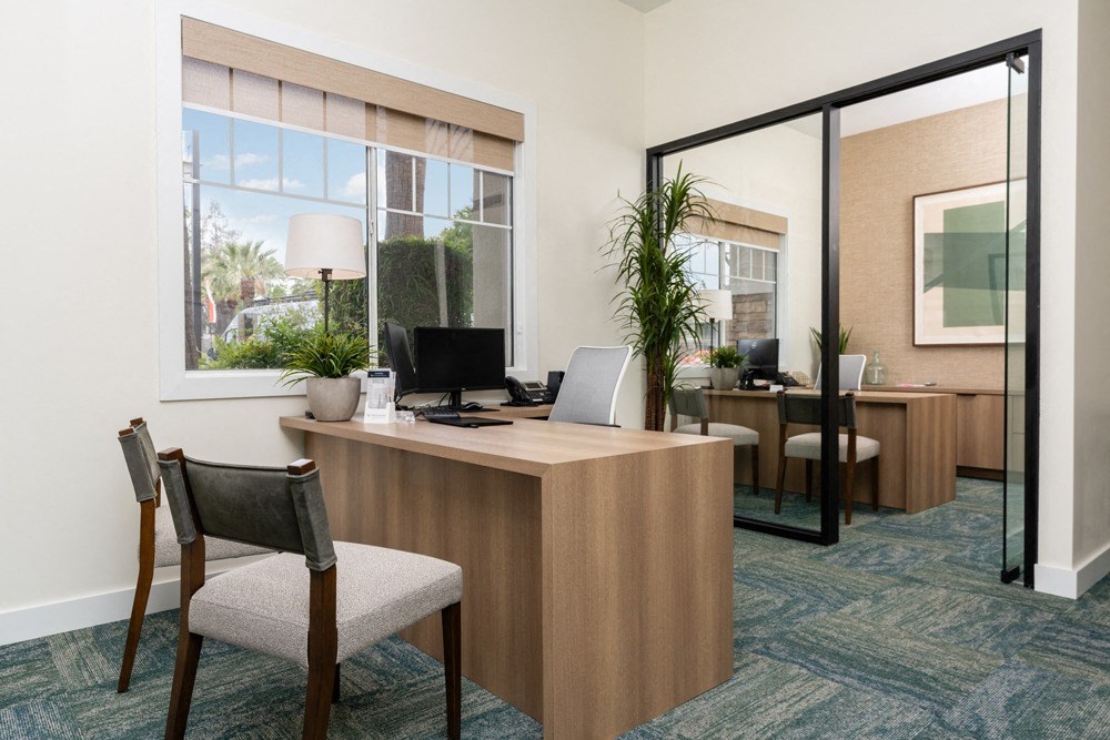 a office with a desk and a window