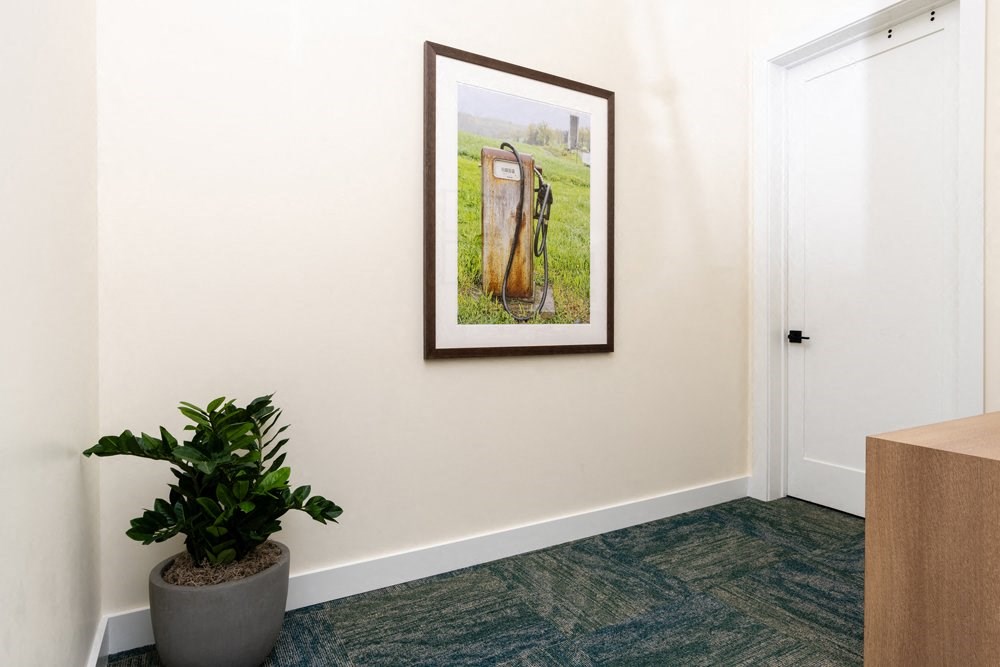 a picture hanging on a wall in a room