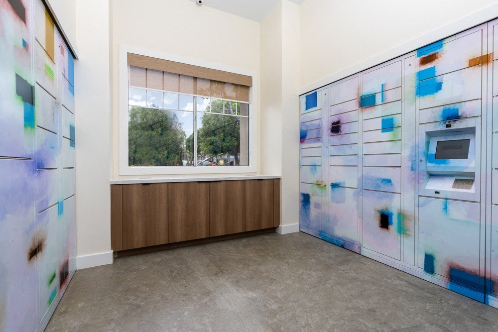 a room with two lockers and a window