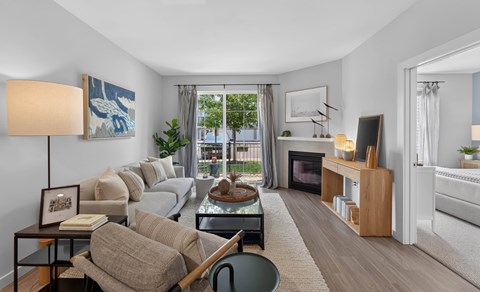A living room with a couch, chair, and coffee table.