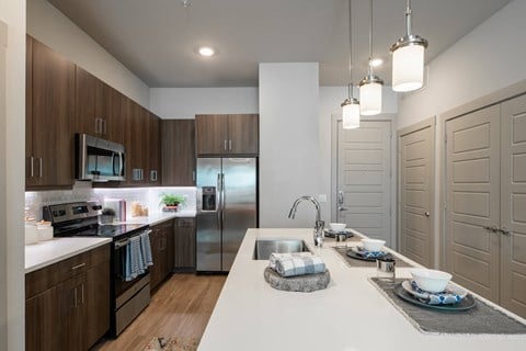 Modern Kitchen Featuring Breakfast Bar and Wood-Style Flooring