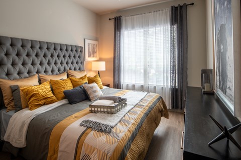 Comfortable Bedroom with Accent Lighting and Decorative Art