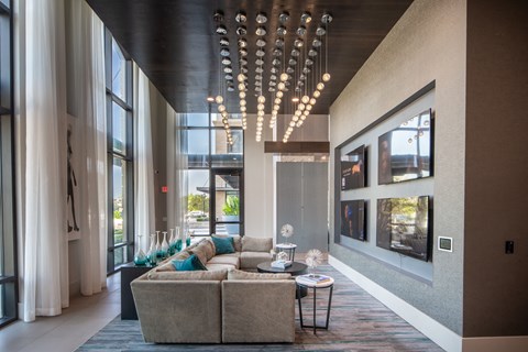 Community Lounge with TV Wall and Plush Sectional Seating