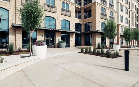 Entrance to Domain at The Gate with Grand Arched Windows and Landscaped Walkway