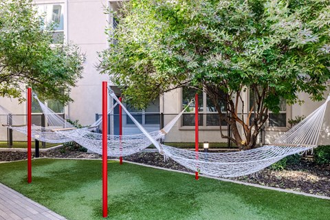 Outdoor Courtyard with Cabanas, Hammocks, and Peaceful Zen Garden
