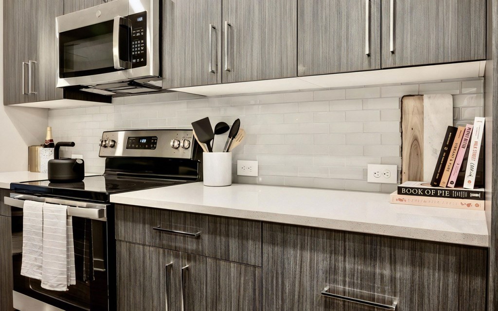 Kitchen Countertop with Cabinets, Books, and Cooking Utensils