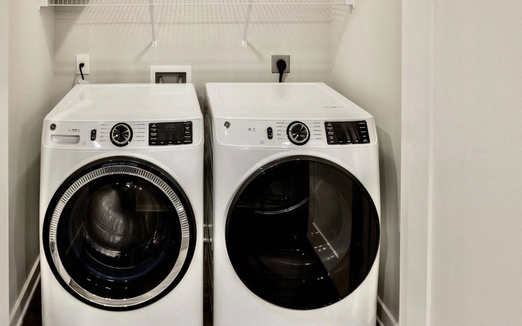 In-Unit Side-by-Side Washer and Dryer with Wire Shelf Above