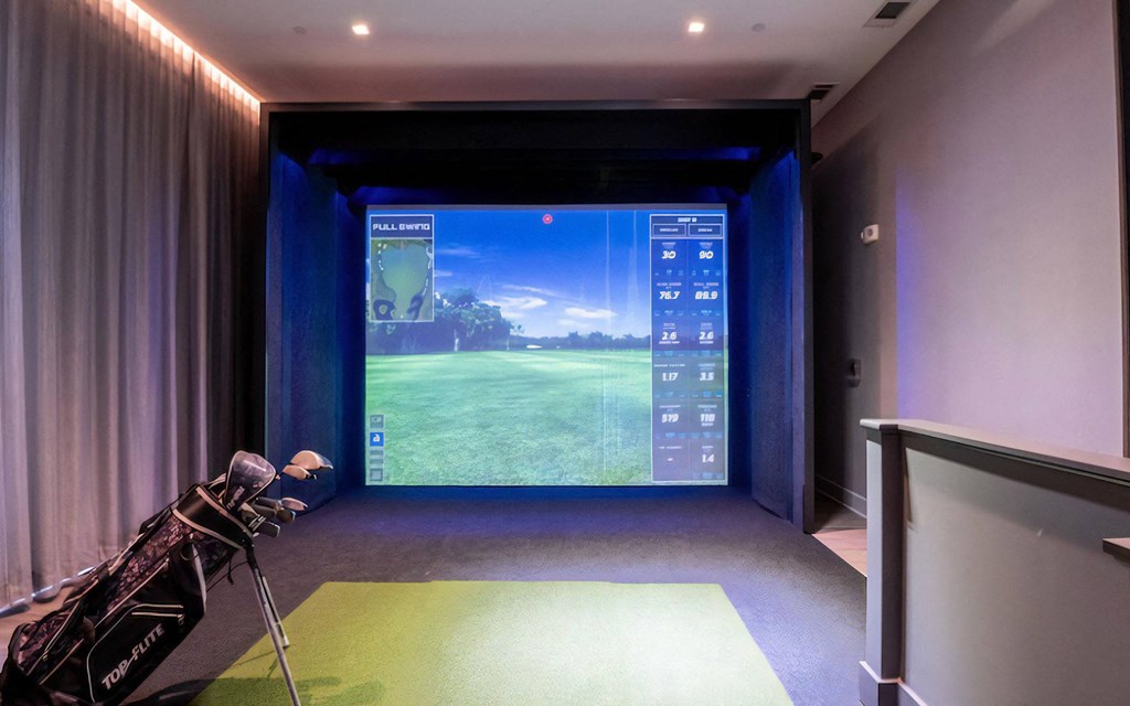 Golf Practice Bay Featuring Hitting Mat and Virtual Course Projection