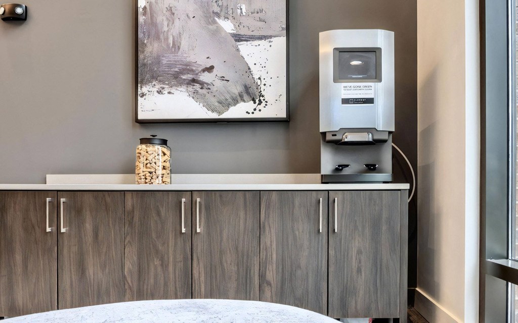 Common Area Featuring Refreshment Station and Storage Cabinets