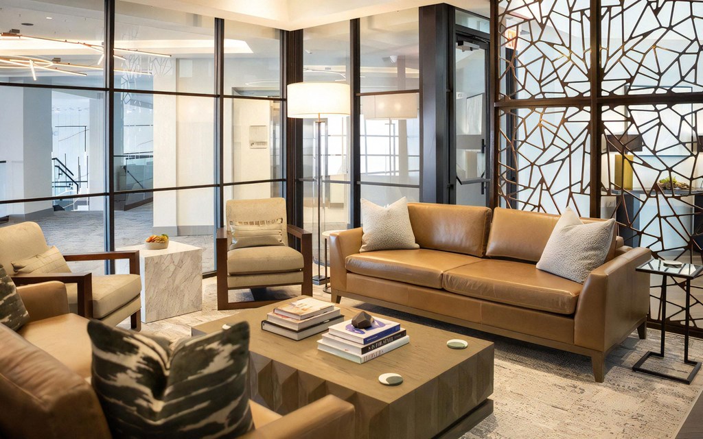 Resident Lounge with Leather Seating and Floor-to-Ceiling Windows