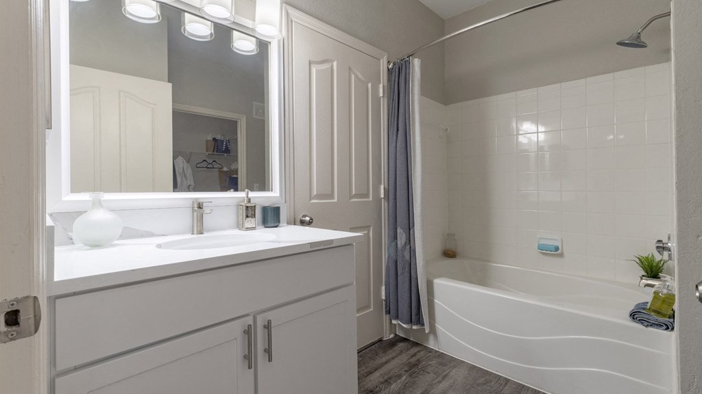 Modern Bathroom with Large Framed Mirror and Ample Storage