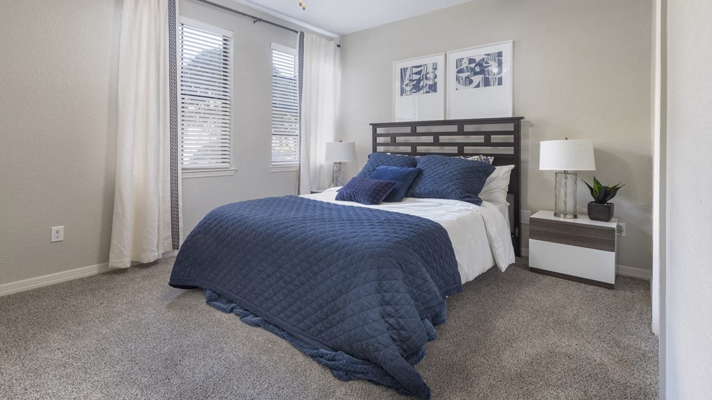 Spacious Bedroom with Modern Furniture and Large Windows