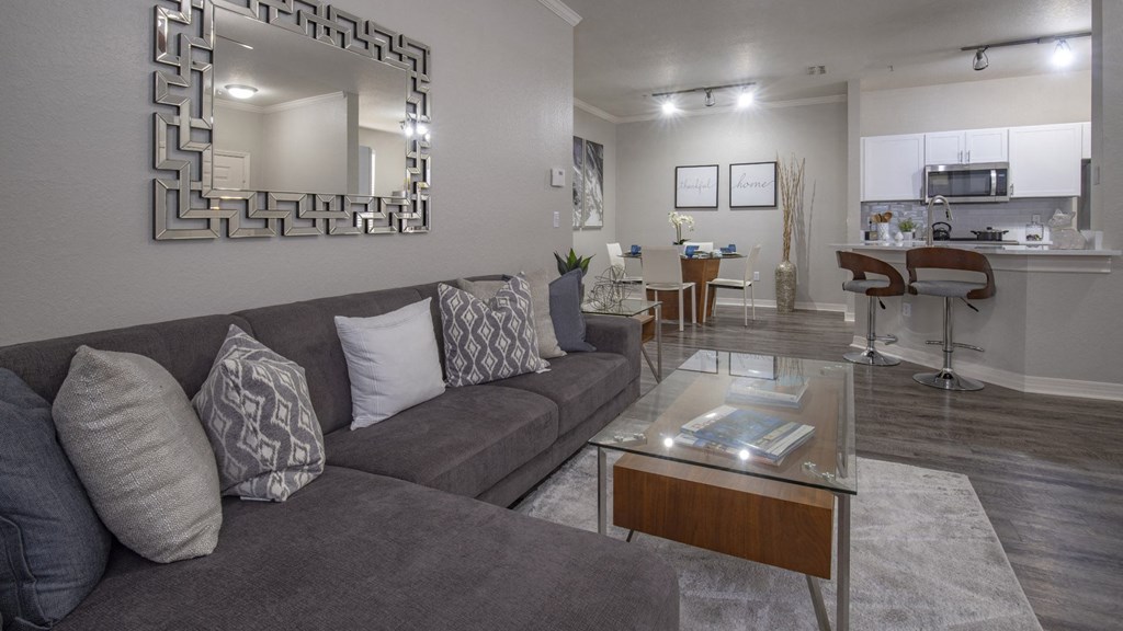 Living Room with Dining Nook and Modern Kitchen in Background