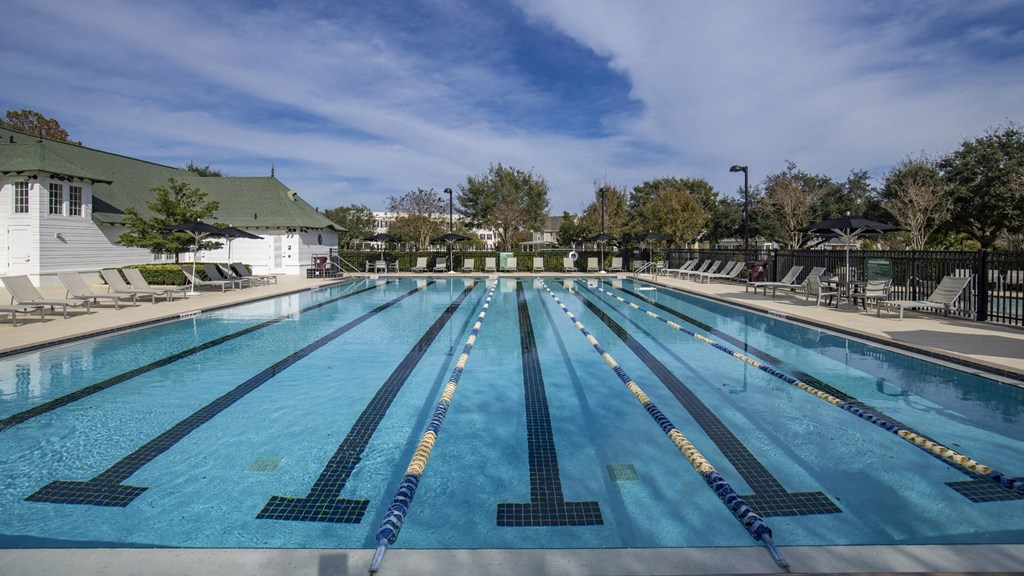 Outdoor Resort-Style Lap Pool with Chaise Lounges and Sun Deck