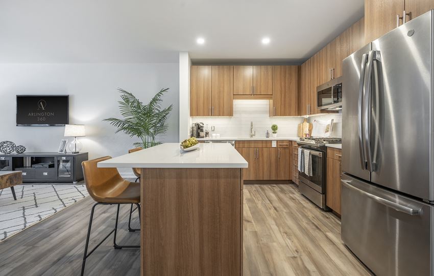 kitchen with island, counter seating, stainless steel appliances and granite countertops - luxury arlington ma apartments - Photo Gallery