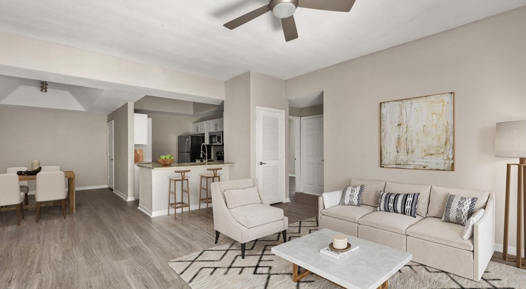 A living room with a white couch and a coffee table.