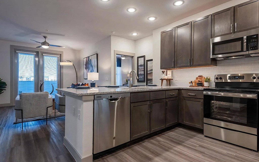 Stylish Kitchen with Dark Wood Cabinets and White Subway Tile Backsplash