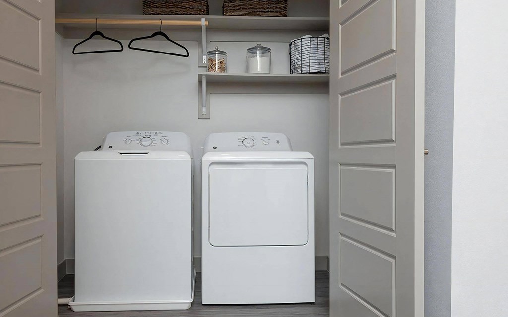 In-Unit Laundry with Full-Size Washer and Dryer and Built-In Shelving