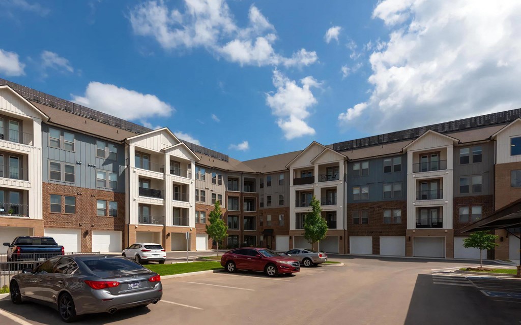 Parking Lot View of The Harper Apartments with Attached Garages
