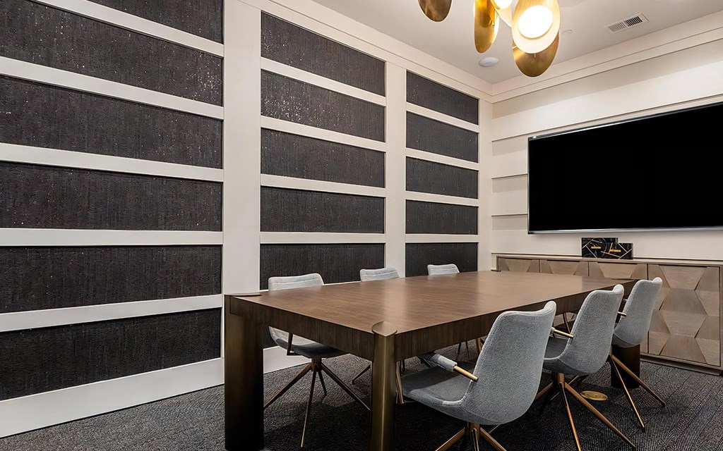 Business Center with Modern Table, Chairs, and TV Display