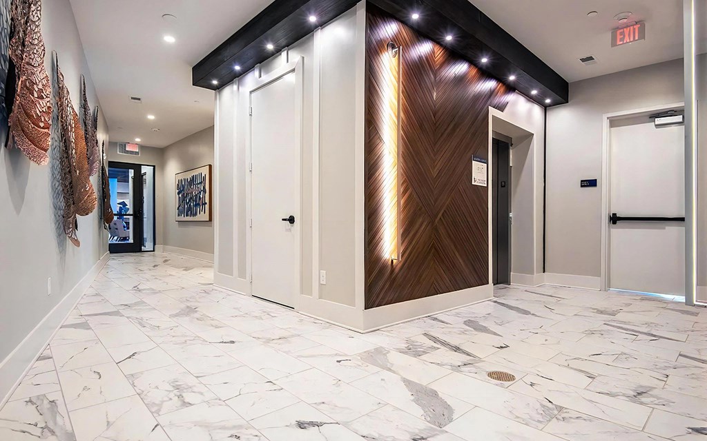 Modern Clubhouse Hall with Sleek Wood and Lighting Accents