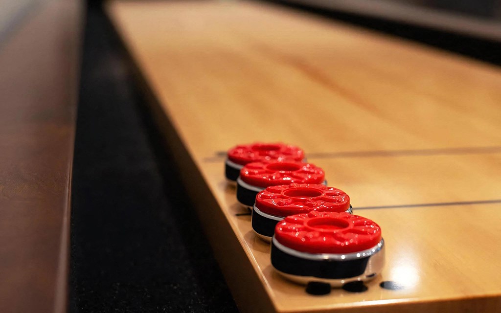 Clubhouse Shuffleboard Table with Bright Red Game Pieces