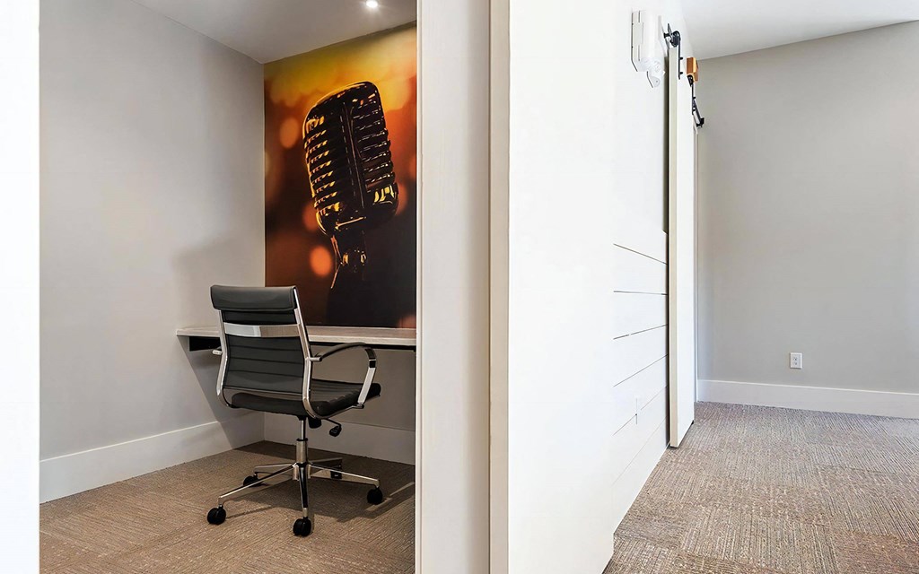 Small Workspace with Chair and Microphone-Themed Wall Art
