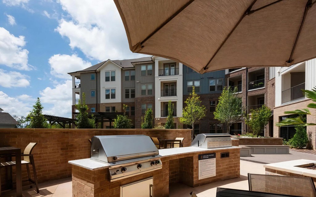 Dual Community Grilling Stations in Outdoor Kitchen Setting