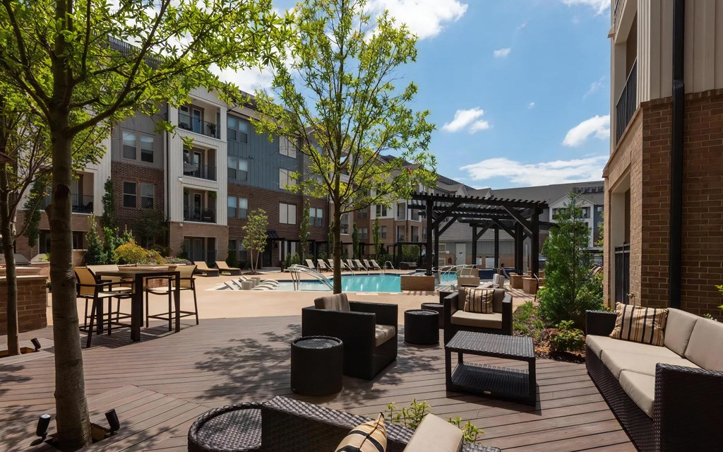 Shaded Seating Area with Comfortable Furniture Near Pool Deck