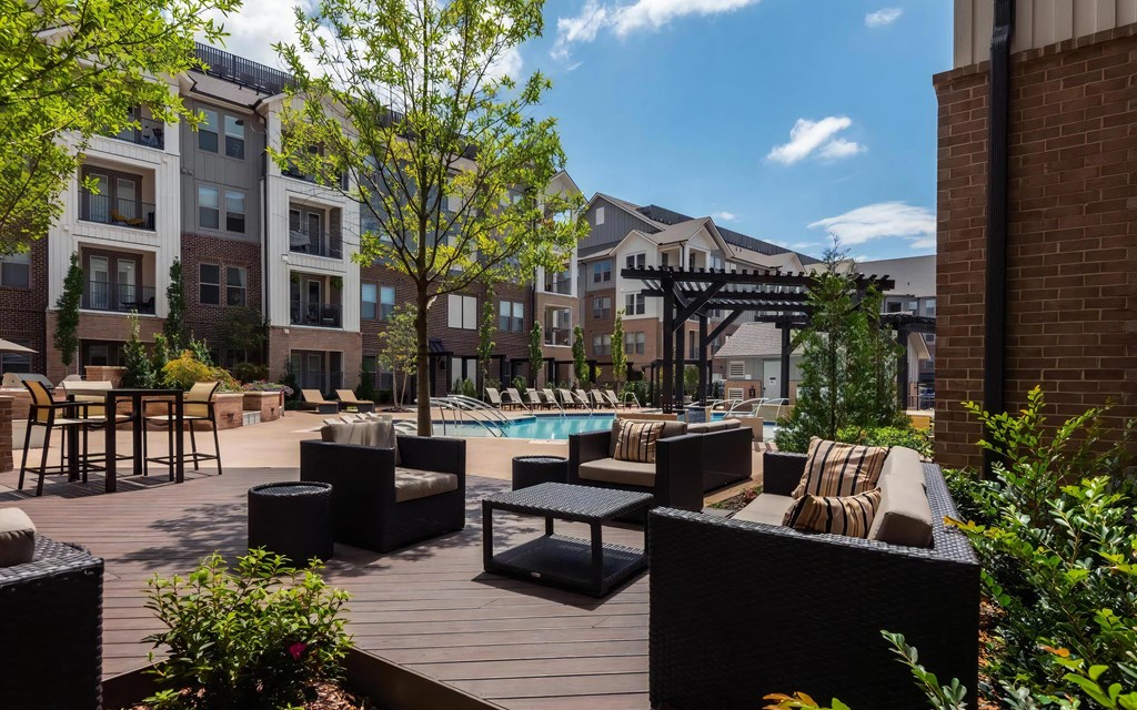 Covered Lounge Area with Modern Furniture Facing the Pool
