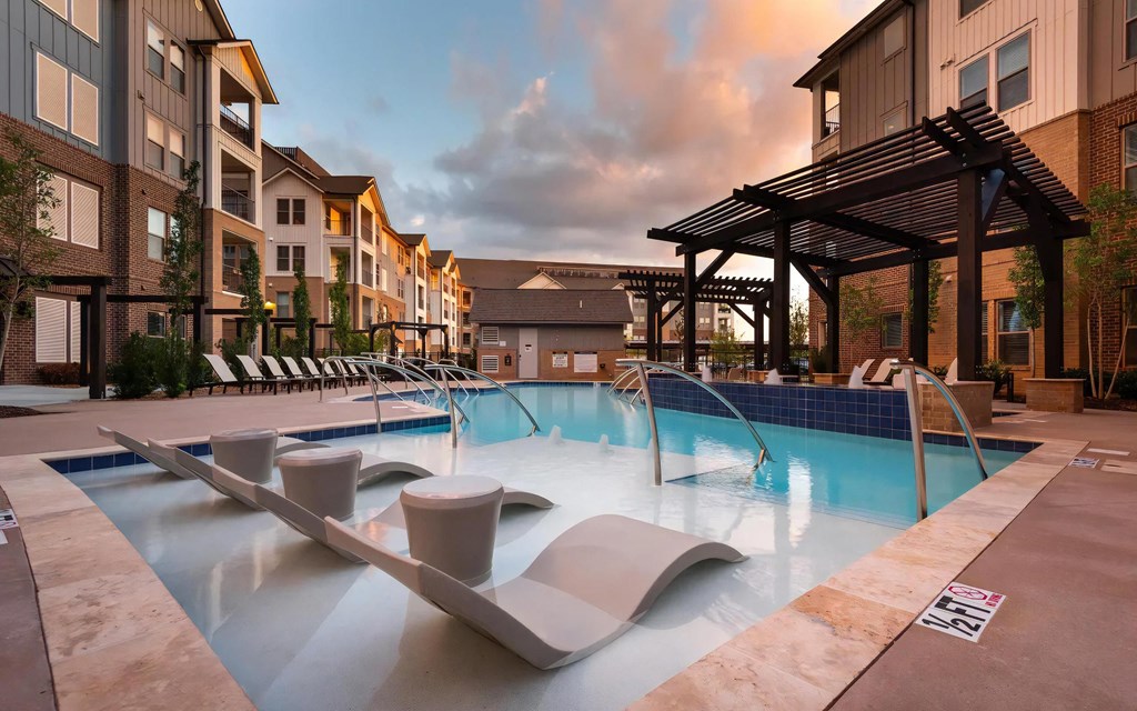 Spacious Pool Area with Ample Seating and Modern Landscaping