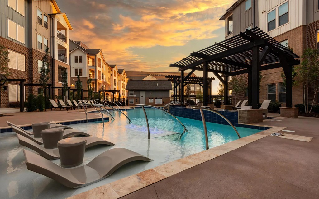 Sunset Views Over Resort-Style Pool with In-Water Seating