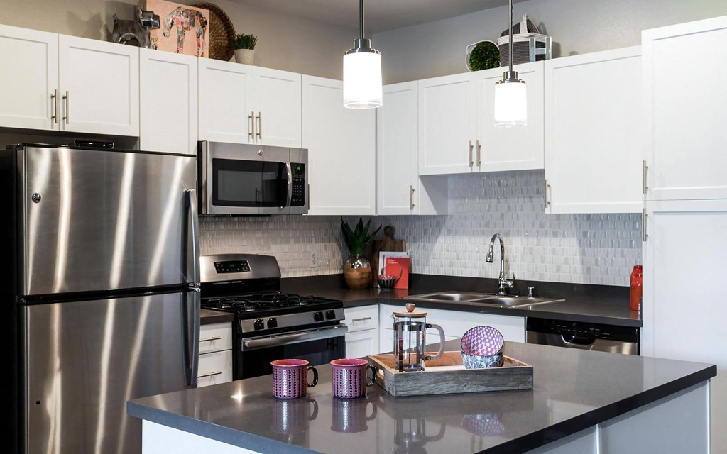 Kitchen with Breakfast Bar Ample Cabinet Space and Self Closing Drawers