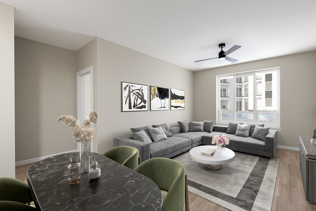 Modern Living Space with Gray Sofa, Neutral Tones, and Dining Area in Foreground