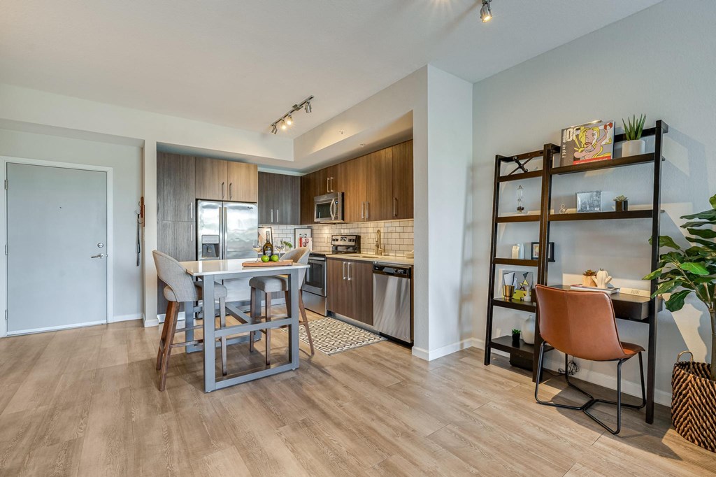 Kitchen and Dining Area with Built-In Shelves and Compact Work Desk