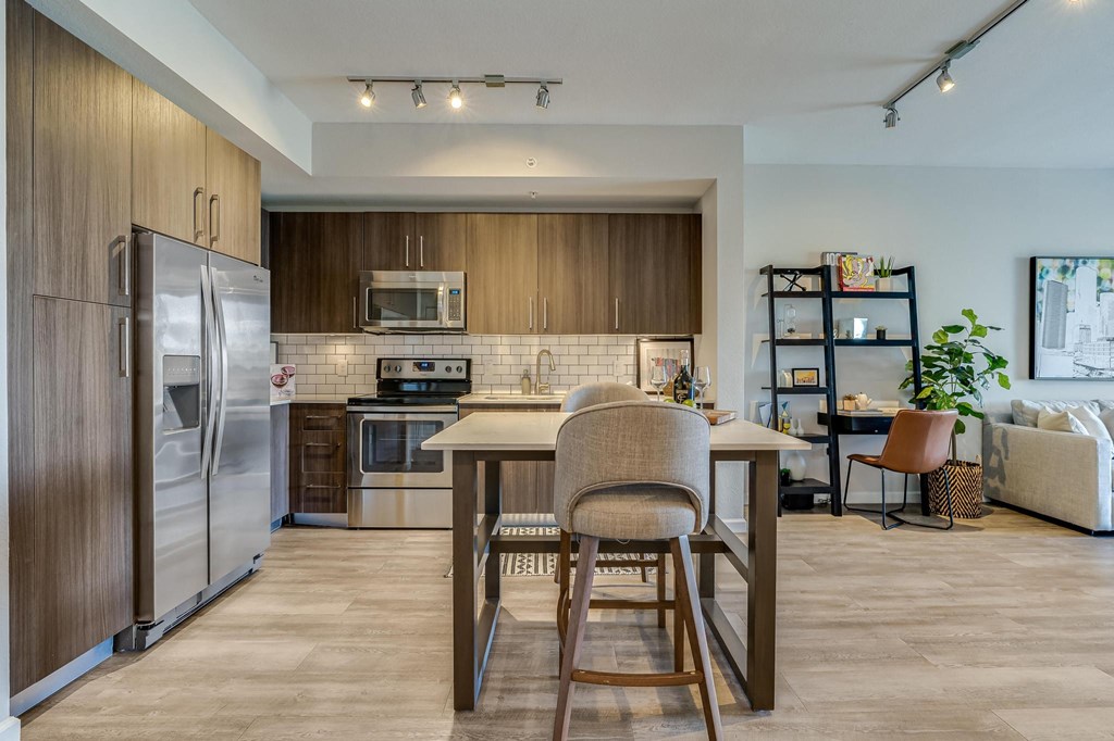 Open Kitchen with Island Seating and View into Living Room