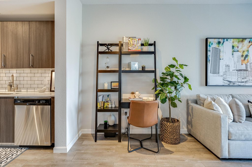 Living Room with In-Home Workspace with Bookshelves and Chair