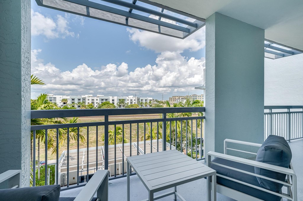 Private Balcony with Seating and Open Sky Views