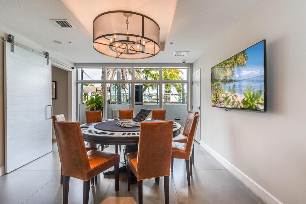 Private Event Room Featuring Leather Chairs, Wall-Mounted TV, and Outdoor Views