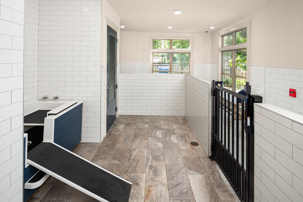 Pet Wash Room with Raised Tub, Ramp, and Secure Gated Entry