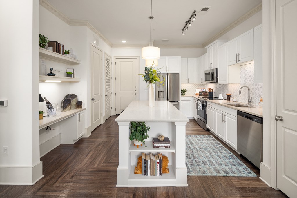 White Cabinet Kitchen with Island Book Storage and Wood-Style Flooring