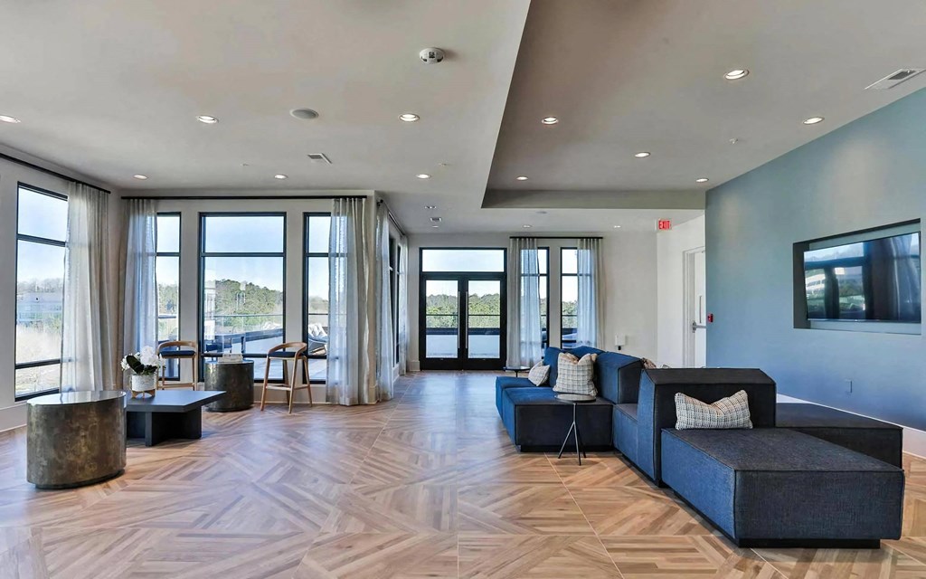 Community Lounge with Floor-to-Ceiling Windows and Lounge Seating