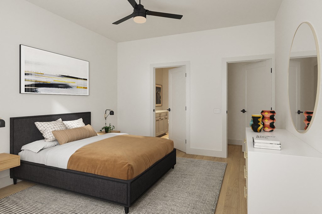 a bedroom with a bed and a ceiling fan